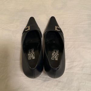 Shoes with metal Ferragamo logo